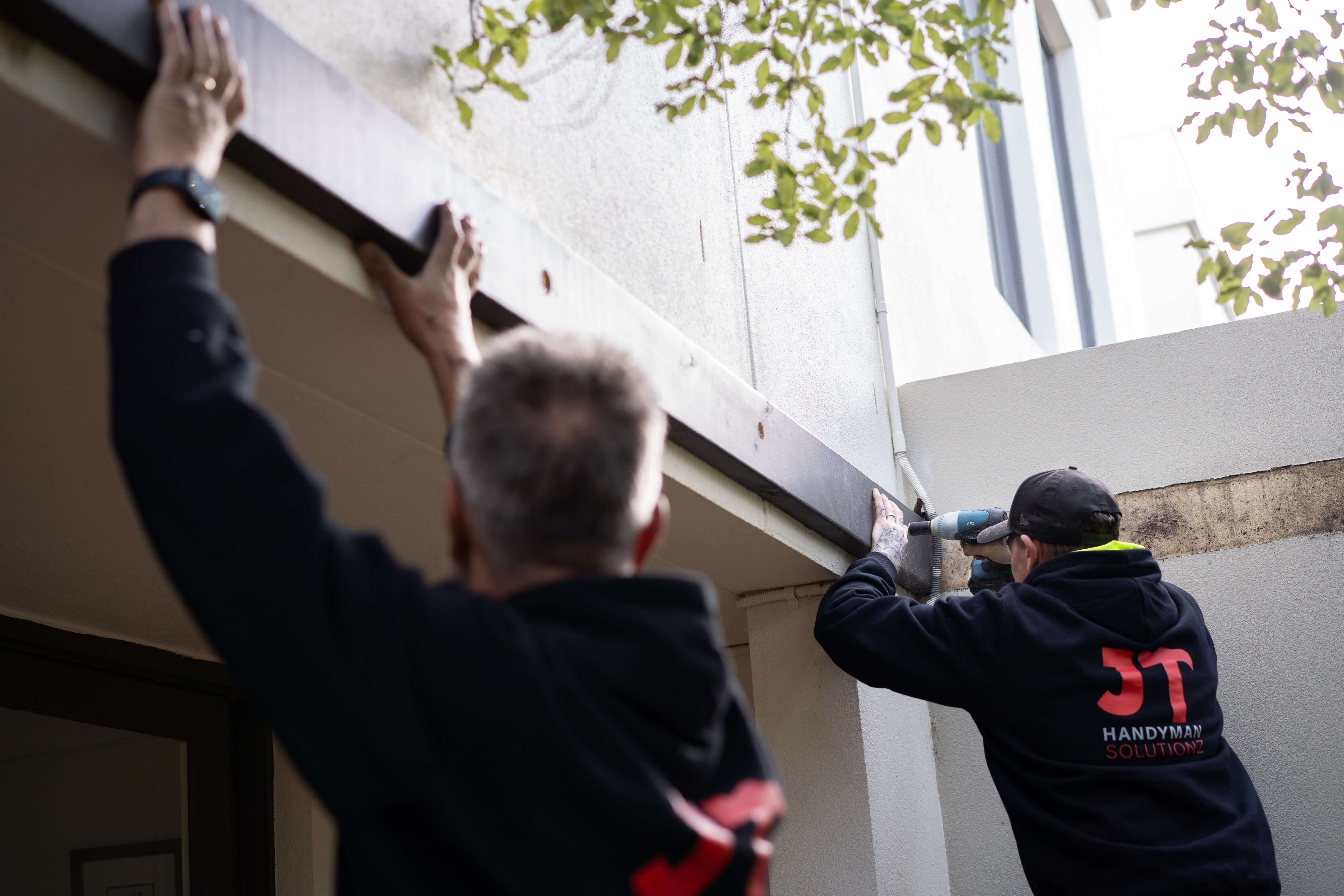 Jabez, founder of JT Handyman Solutionz, on the tools with the crew