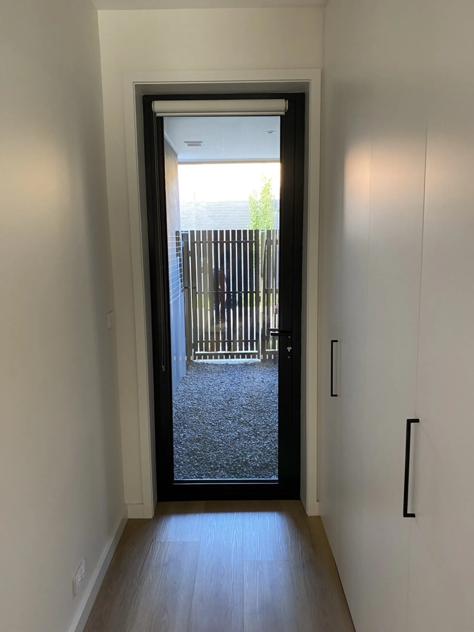 Finished hallway with glass courtyard door by JT Handyman in Melbourne