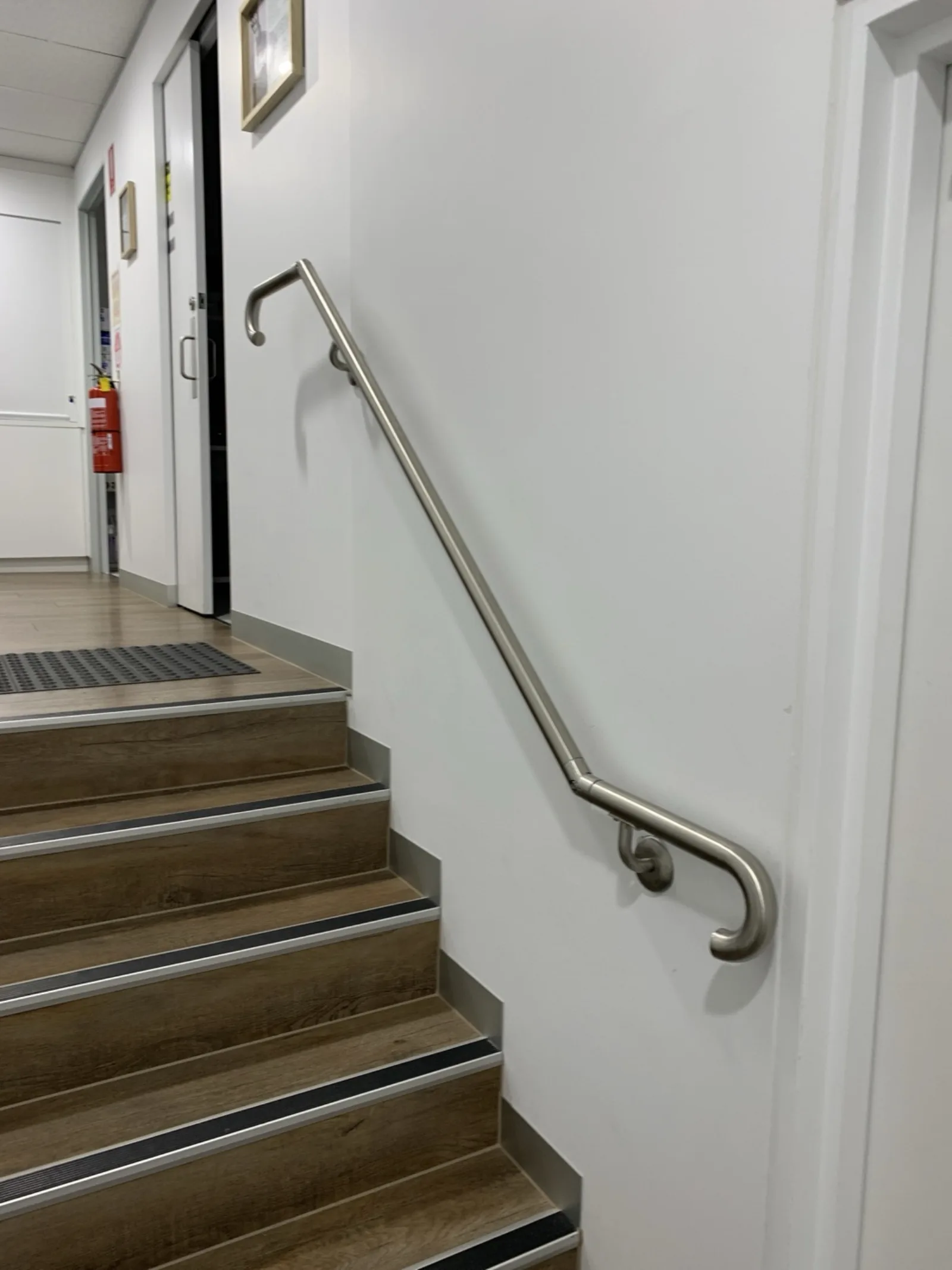 Stainless steel stair handrail install by JT Handyman in South Yarra