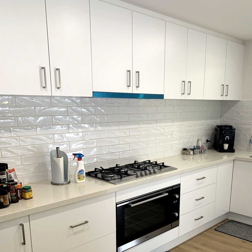 Finished kitchen with white cabinetry by JT Handyman in Croydon