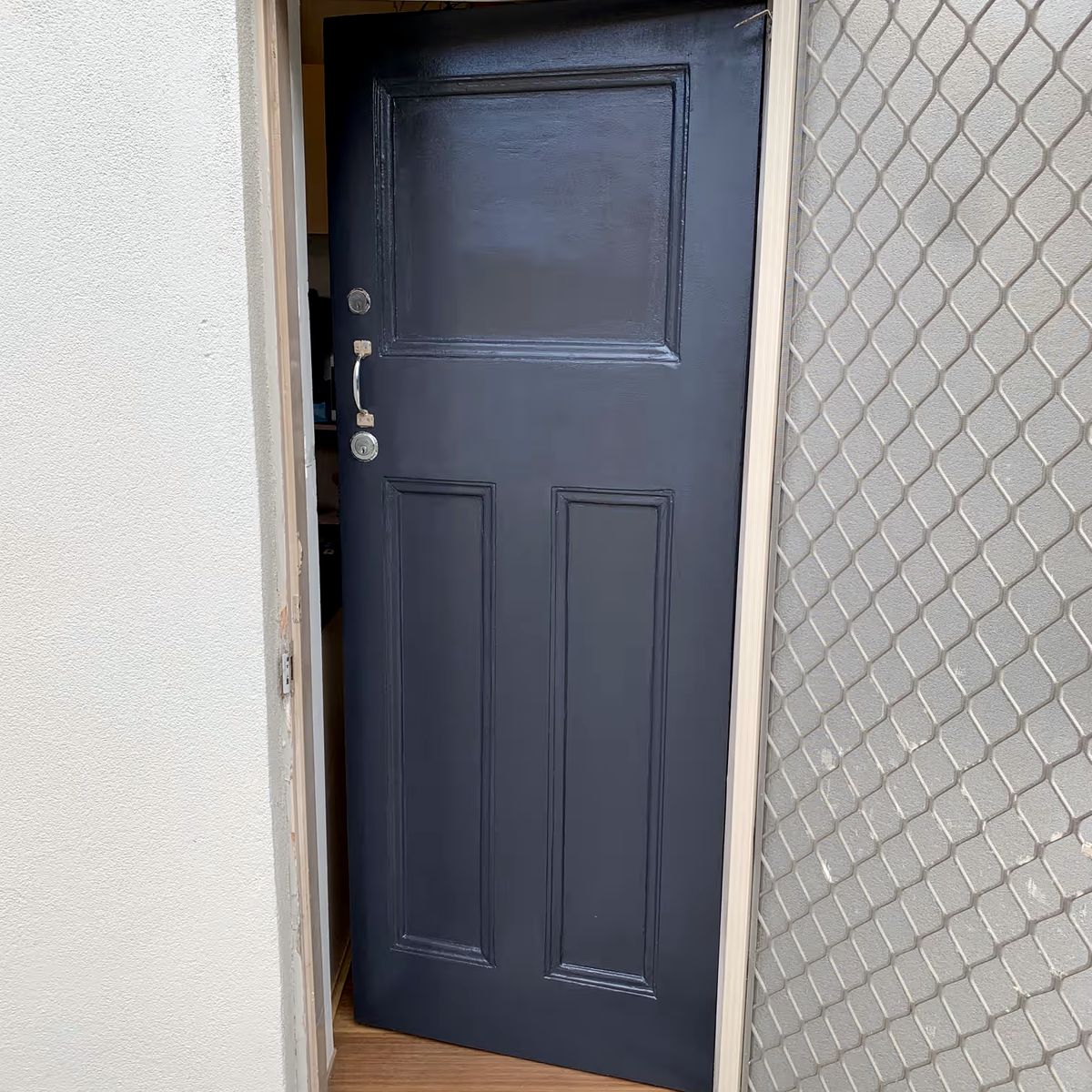 Painted period panel door with security screen by JT Handyman in Elwood