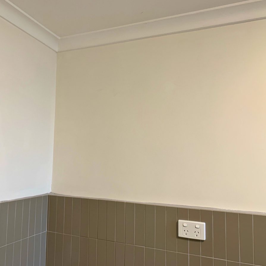 Repaired and painted wall and cornice above a tiled dado by JT Handyman Solutionz