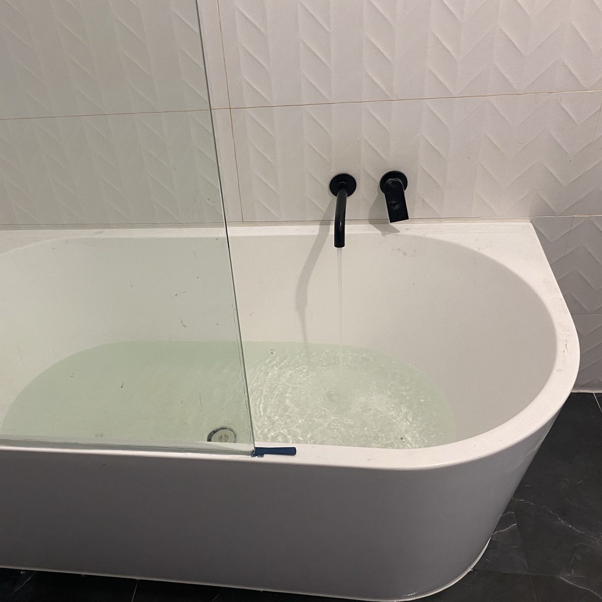 Freestanding bath with a wall-mounted spout filling, installed by JT Handyman in Melton