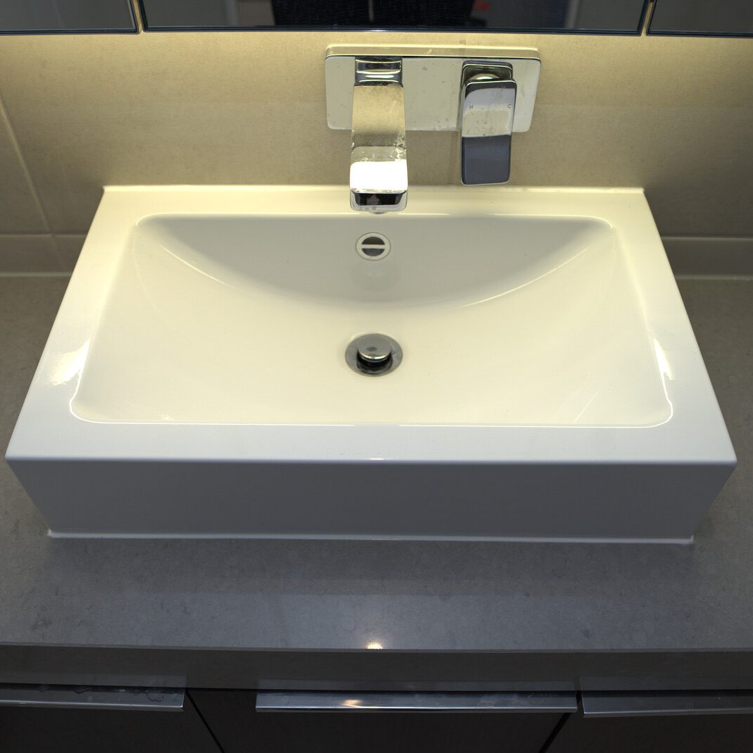 Wall-mounted mixer and basin installed by JT Handyman Solutionz