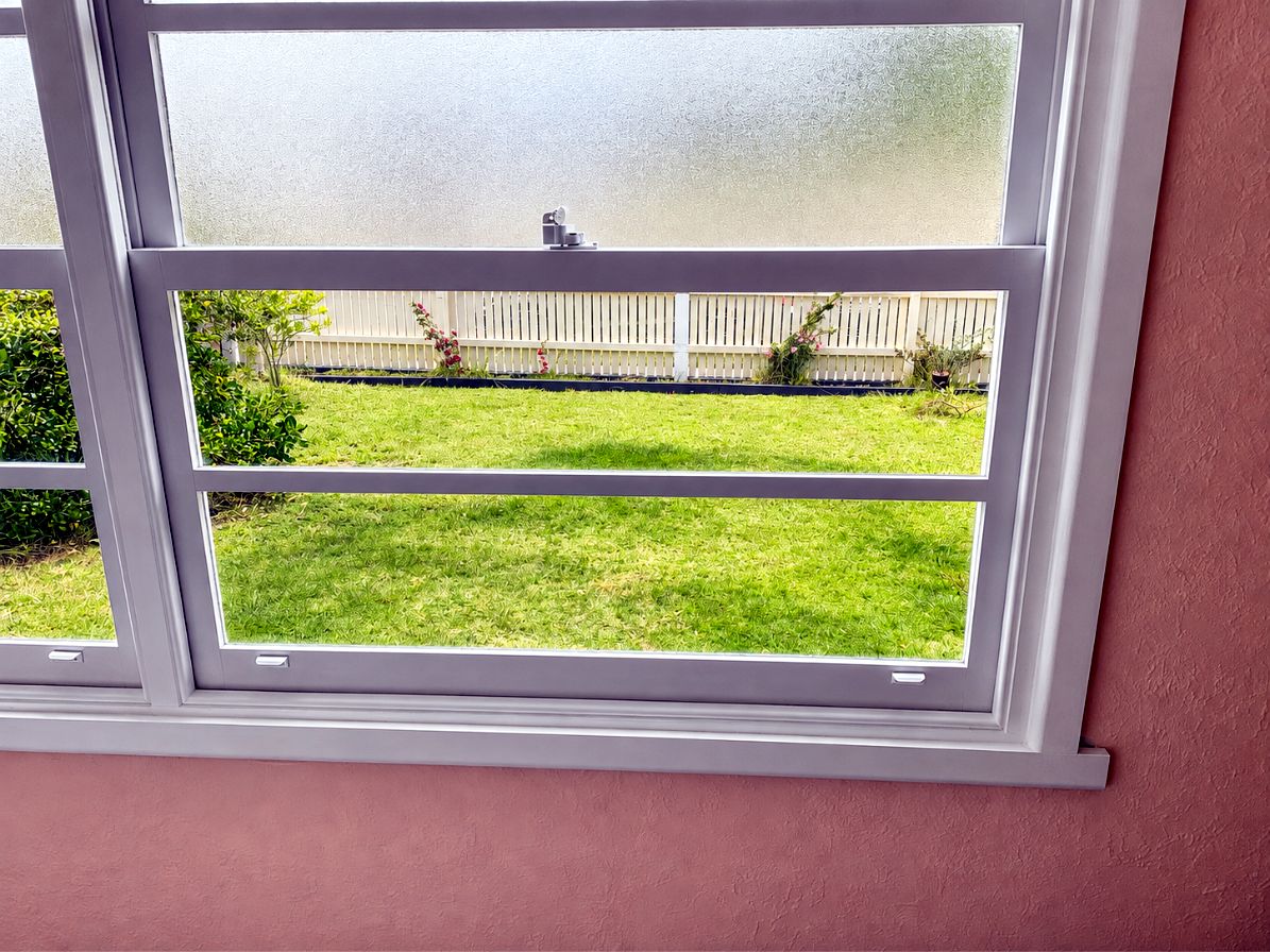 Installed awning window with frosted upper pane by JT Handyman Solutionz