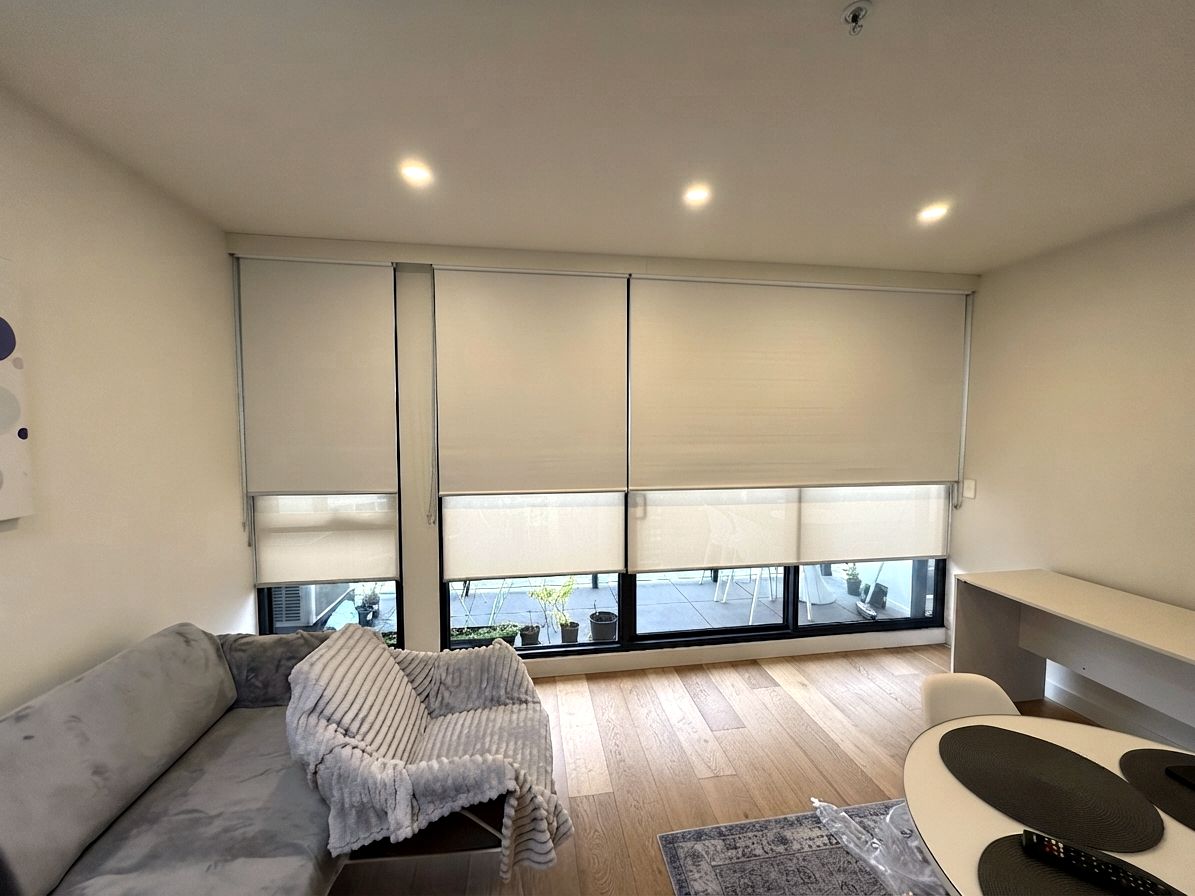 Roller blinds installed in an apartment living room by JT Handyman Solutionz