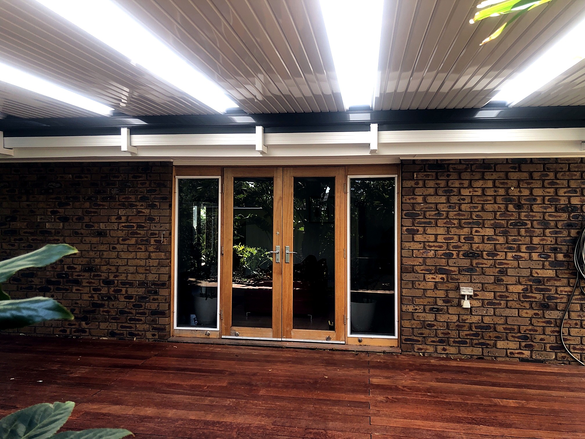 Timber deck and pergola with French doors by JT Handyman in Altona Meadows