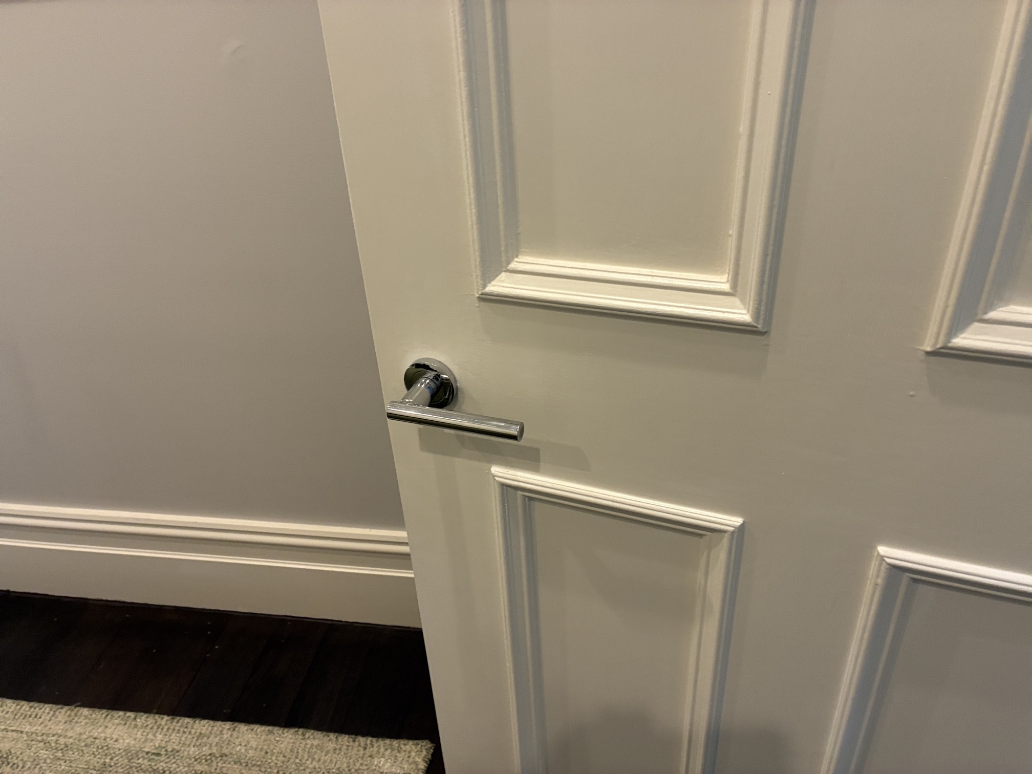 Freshly painted white panel door by JT Handyman in Albert Park